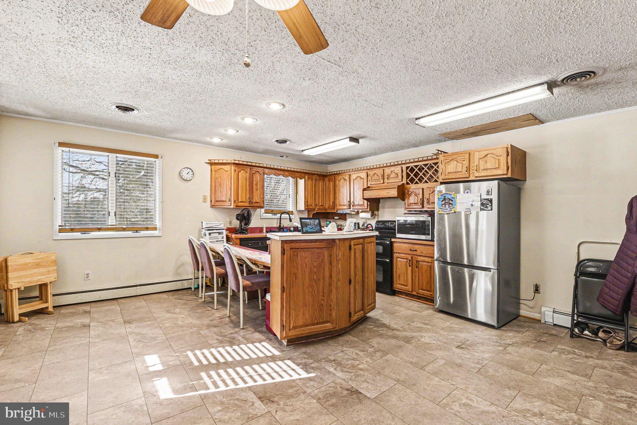 677 Dr Miller Road North East, MD 21901 - Photo 10 of 28 a view of kitchen with furniture and refrigerator