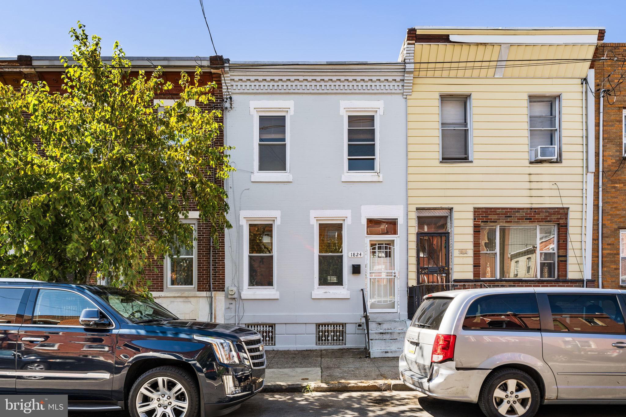 a front view of a house with parking space