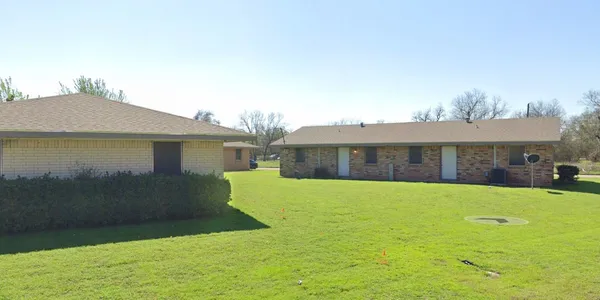 a front view of a house with yard