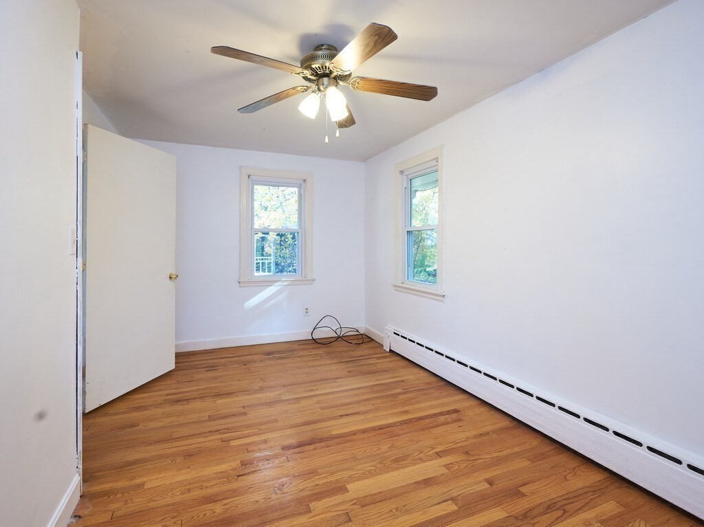 85 Shepard Road Sturbridge, MA 01566 - Photo 13 of 21 wooden floor in an empty room with a window