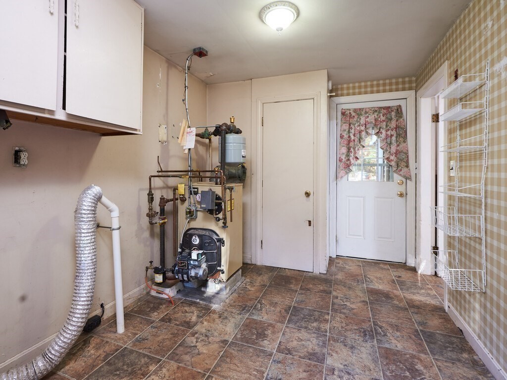 85 Shepard Road Sturbridge, MA 01566 - Photo 15 of 21 a view of a storage & utility room with two washing machine
