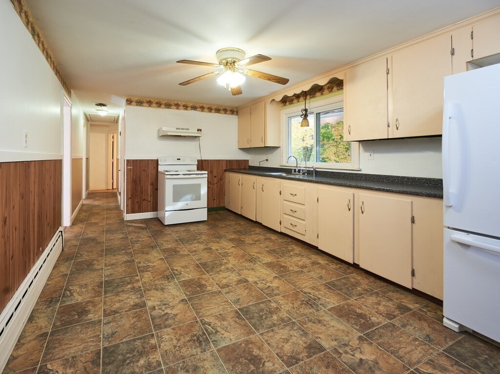 85 Shepard Road Sturbridge, MA 01566 - Photo 9 of 21 a large white kitchen with cabinets