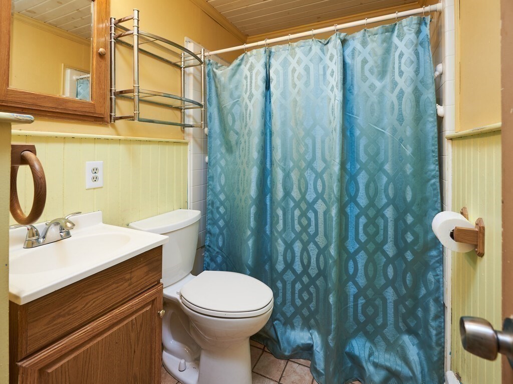 85 Shepard Road Sturbridge, MA 01566 - Photo 10 of 21 a bathroom with a sink a toilet and shower curtain