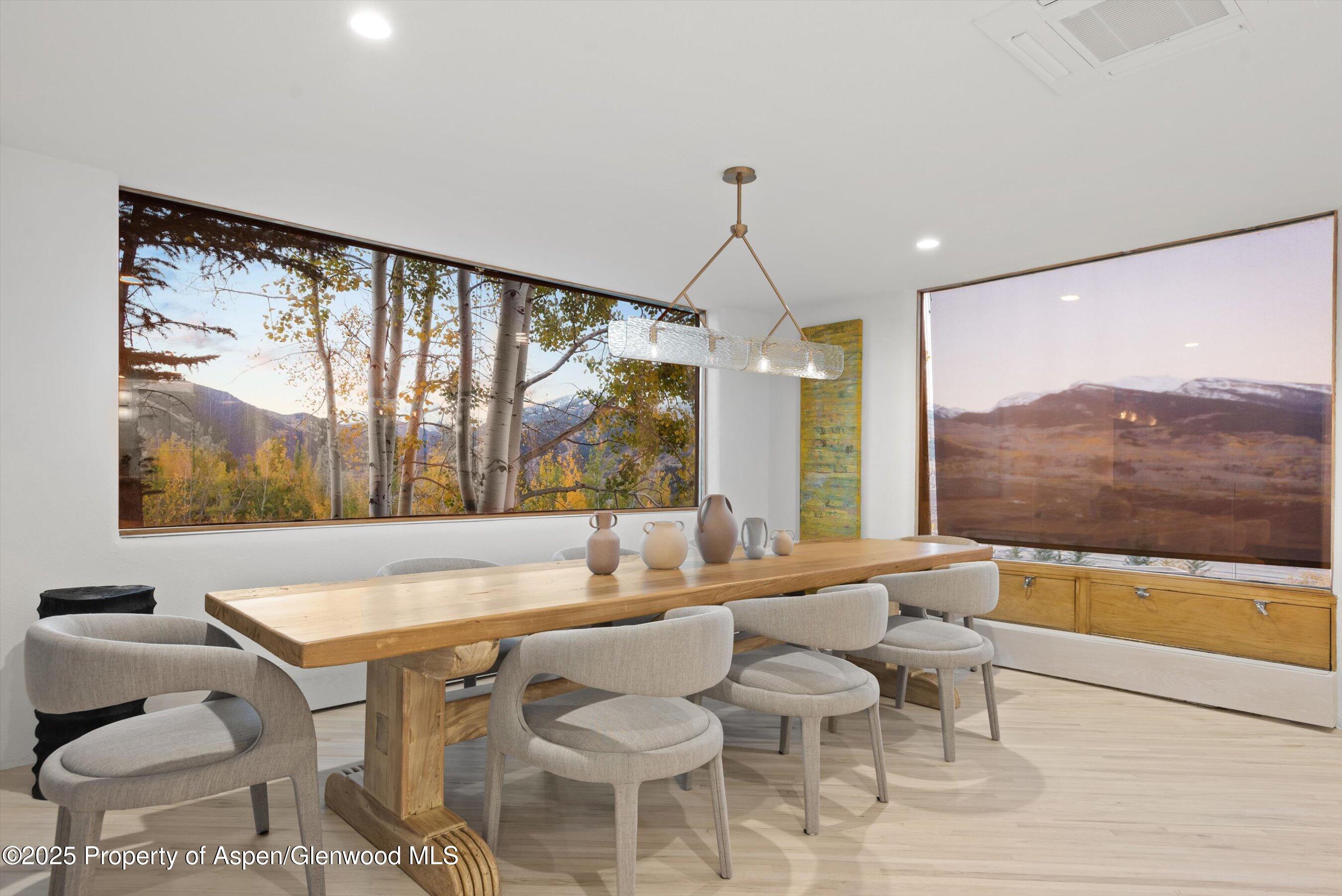 699 Eppley Drive Aspen, CO 81612 - Photo 13 of 45 a room with furniture and large windows