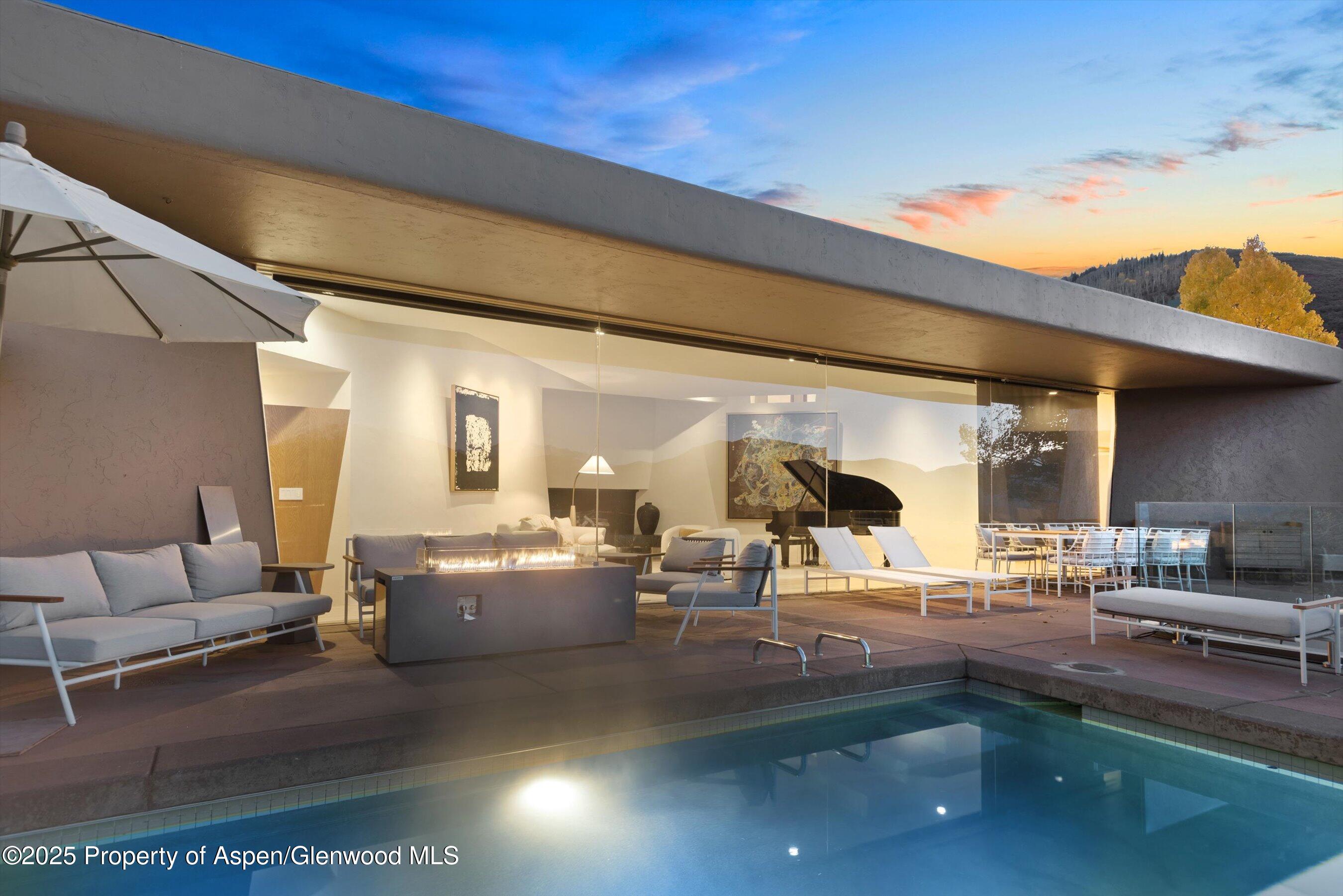 699 Eppley Drive Aspen, CO 81612 - Photo 4 of 45 a living room with lots of furniture and view of kitchen