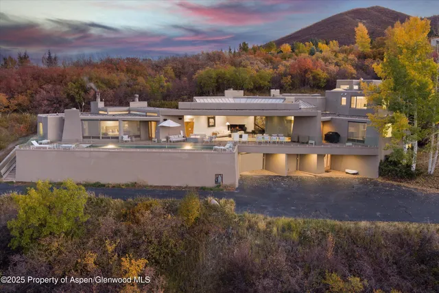 a large body of water with a building in the background