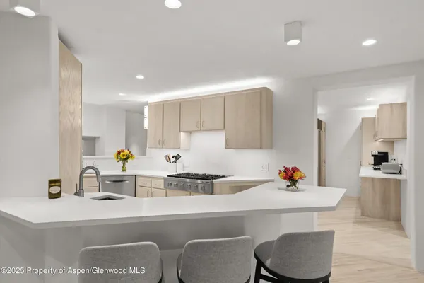 a kitchen with a sink cabinets and counter space