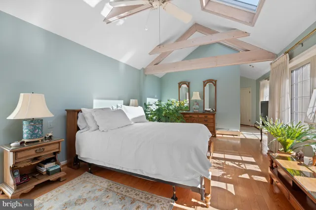 a bedroom with a bed and a lamp