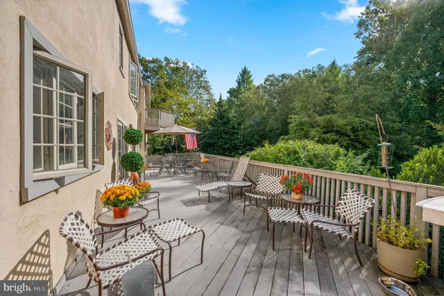an outdoor space with furniture and garden view