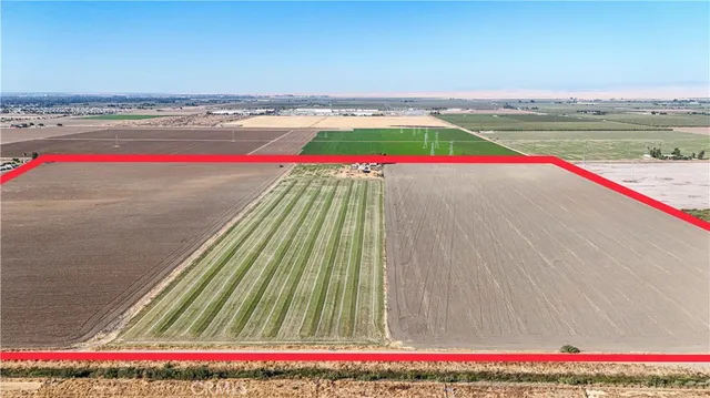 a backyard of a house with a table and chairs