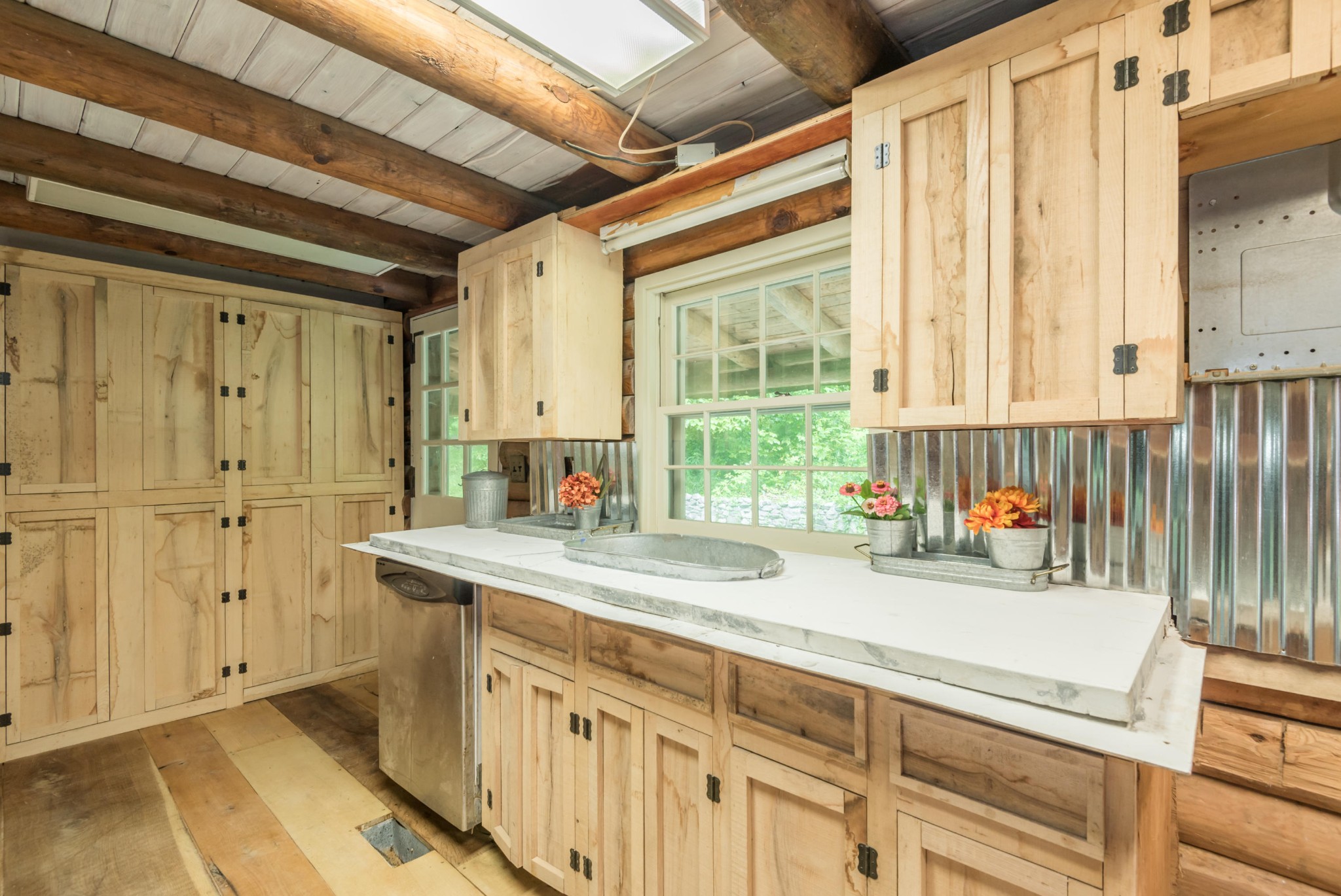 145 Scruggs Cemetery Road Clinton, TN 37716 - Photo 8 of 26 a kitchen with stainless steel appliances a sink and a window