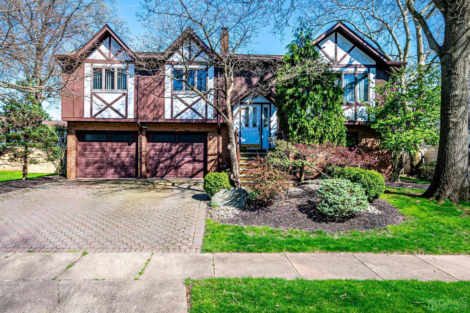 30 Baltic Street Edison, NJ 08820 - Photo 1 of 42 a front view of a house with garden