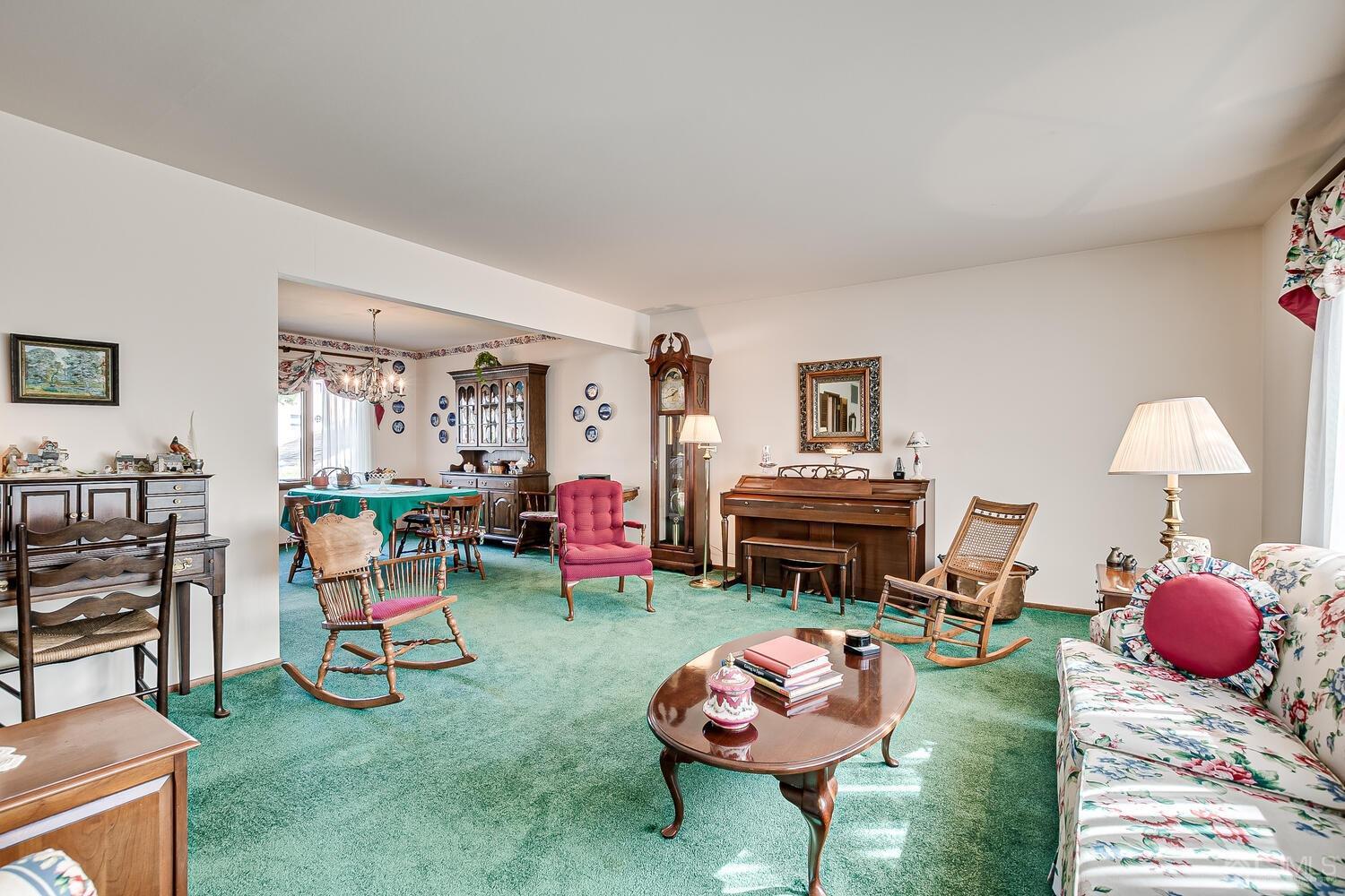 30 Baltic Street Edison, NJ 08820 - Photo 12 of 42 a living room with furniture a chandelier and a fireplace