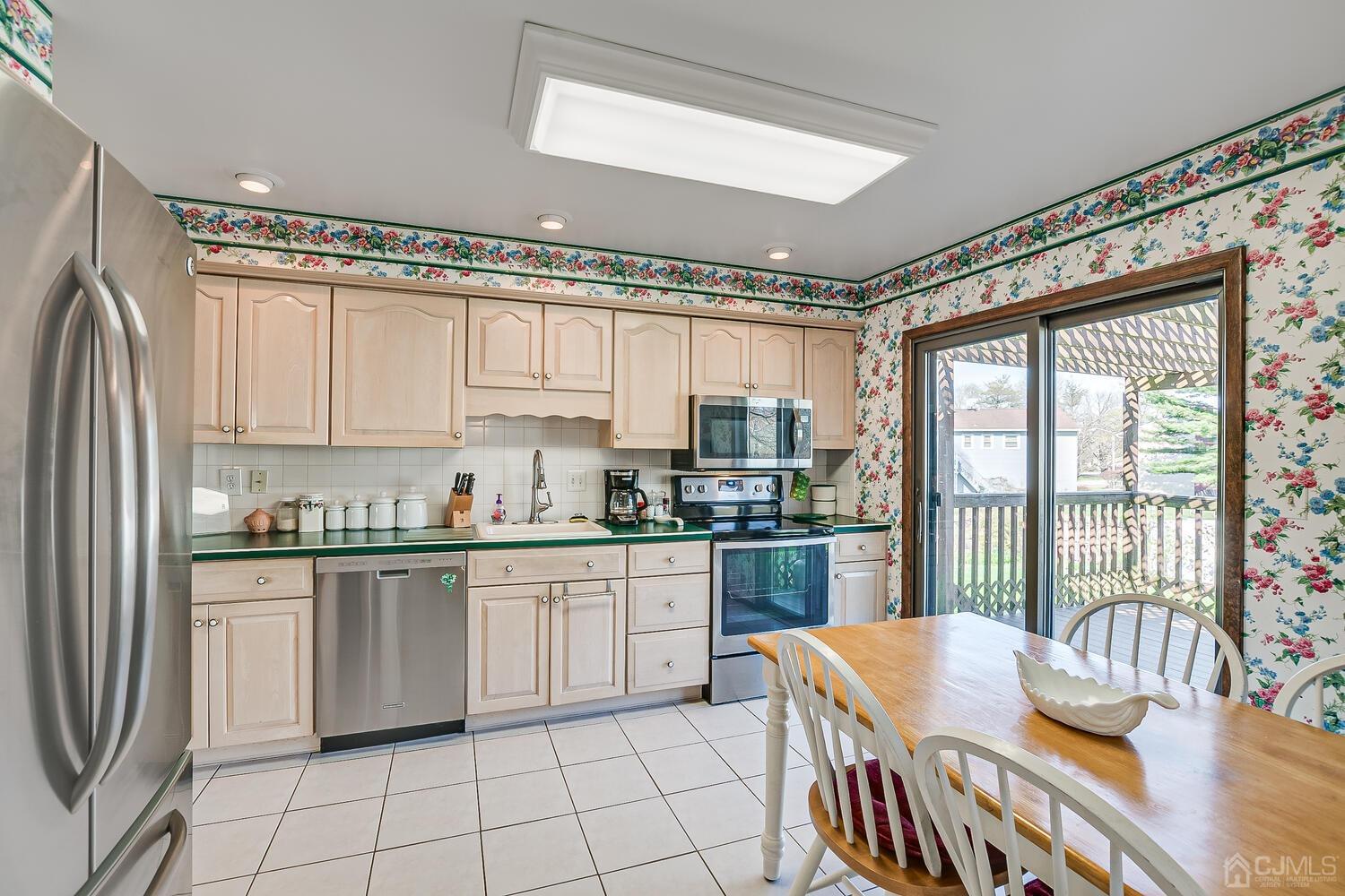 30 Baltic Street Edison, NJ 08820 - Photo 16 of 42 a kitchen with stainless steel appliances granite countertop a stove a sink dishwasher and a refrigerator