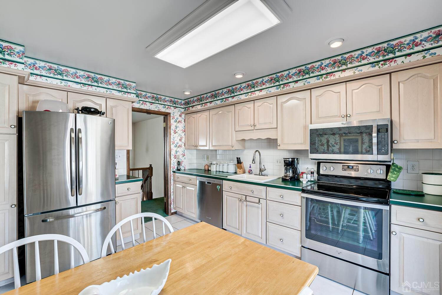 30 Baltic Street Edison, NJ 08820 - Photo 19 of 42 a kitchen with stainless steel appliances a refrigerator sink and cabinets