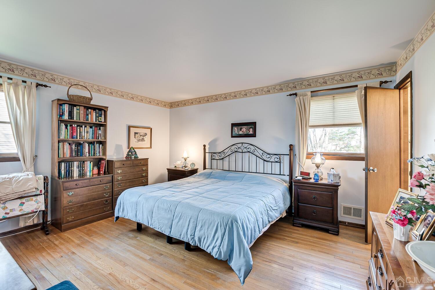 30 Baltic Street Edison, NJ 08820 - Photo 22 of 42 a bedroom with a bed and a book shelf
