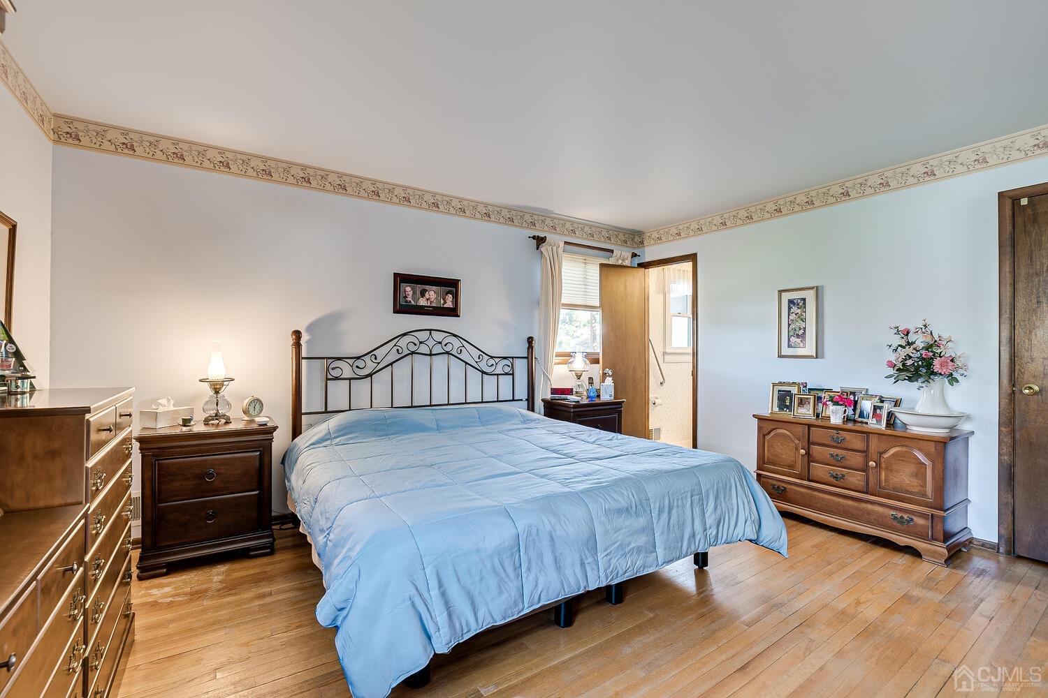 30 Baltic Street Edison, NJ 08820 - Photo 23 of 42 a bedroom with a bed and a dresser