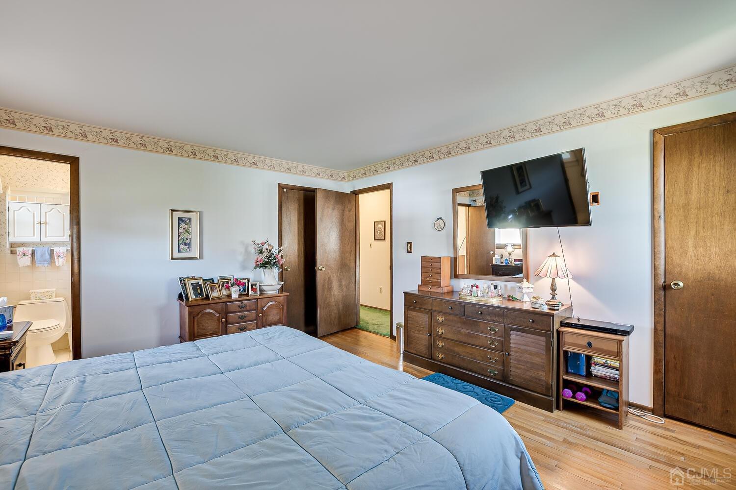 30 Baltic Street Edison, NJ 08820 - Photo 24 of 42 a bedroom with a bed and a flat screen tv