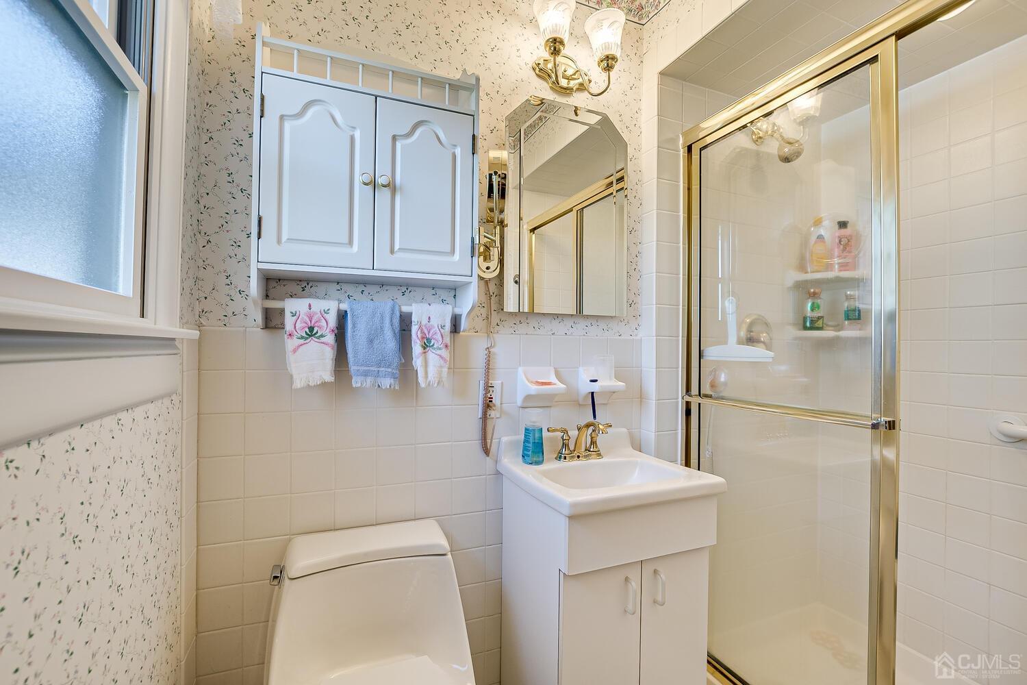 30 Baltic Street Edison, NJ 08820 - Photo 25 of 42 a bathroom with a sink a toilet and shower