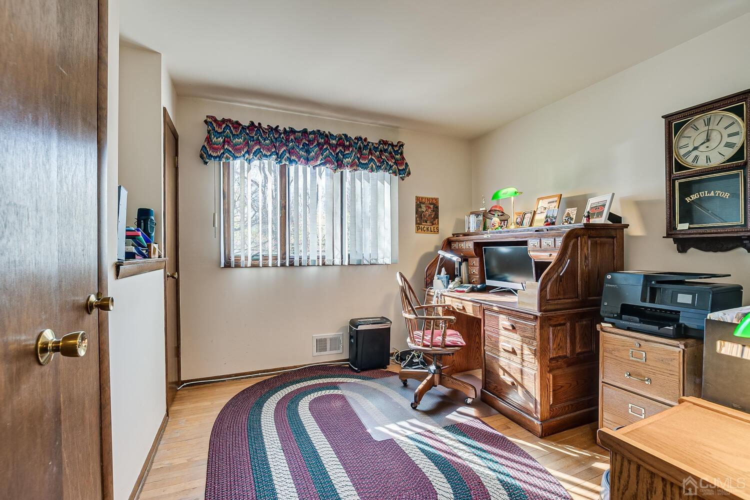 30 Baltic Street Edison, NJ 08820 - Photo 28 of 42 a view of a workspace with furniture and a window