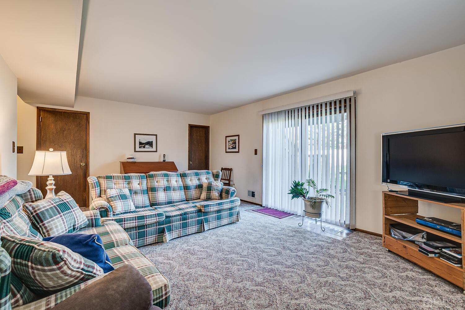30 Baltic Street Edison, NJ 08820 - Photo 32 of 42 a living room with furniture and a flat screen tv