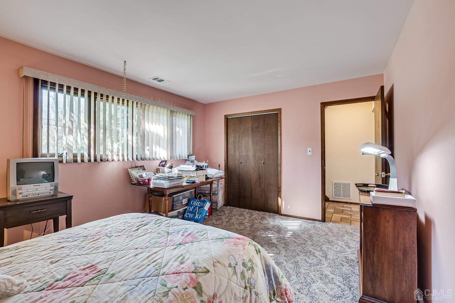 30 Baltic Street Edison, NJ 08820 - Photo 34 of 42 a bedroom with a bed and wooden floor