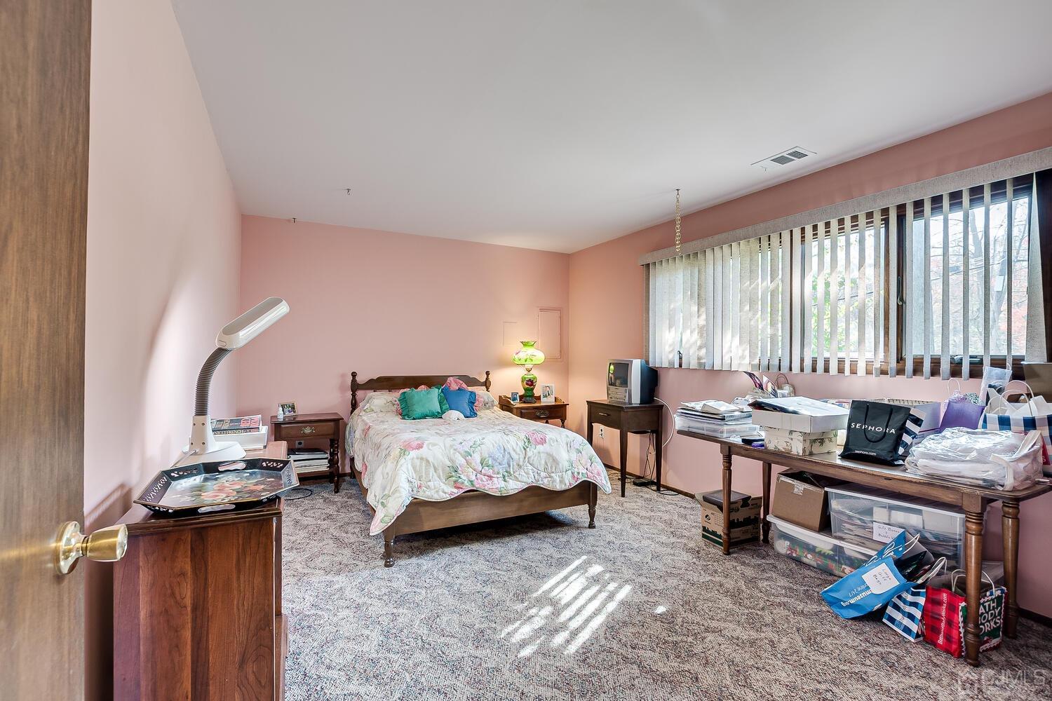 30 Baltic Street Edison, NJ 08820 - Photo 35 of 42 a bedroom with bed and a window