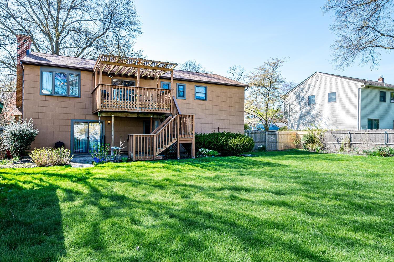 30 Baltic Street Edison, NJ 08820 - Photo 38 of 42 a backyard of a house with wooden fence and large trees