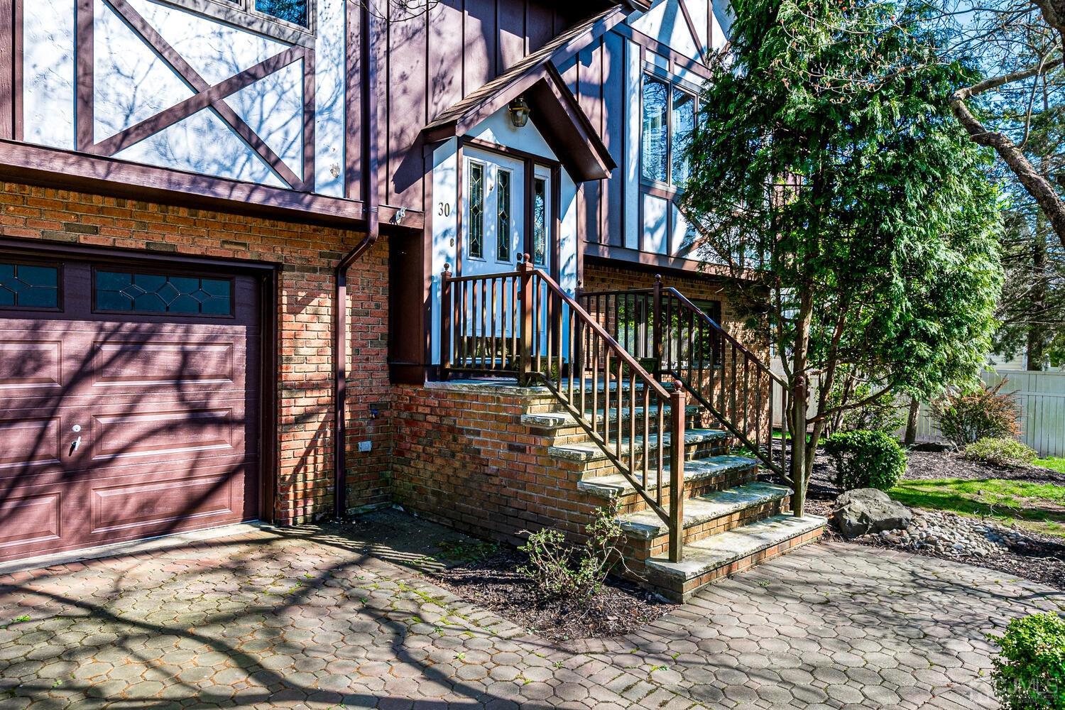 30 Baltic Street Edison, NJ 08820 - Photo 4 of 42 a view of a house with a small yard and wooden fence