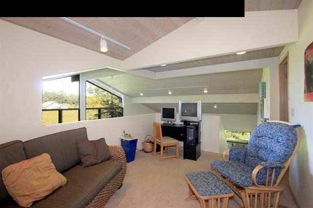 180 Kapuai Road Haiku, HI 96708 - Photo 17 of 29 a living room with furniture and a large window