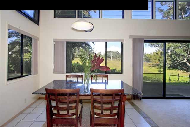 180 Kapuai Road Haiku, HI 96708 - Photo 2 of 29 a view of a dining room with furniture large windows and wooden floor
