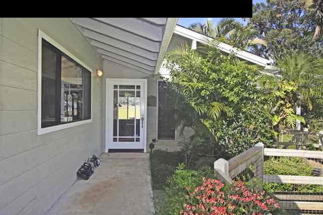 180 Kapuai Road Haiku, HI 96708 - Photo 8 of 29 a front view of a house with lots of green space