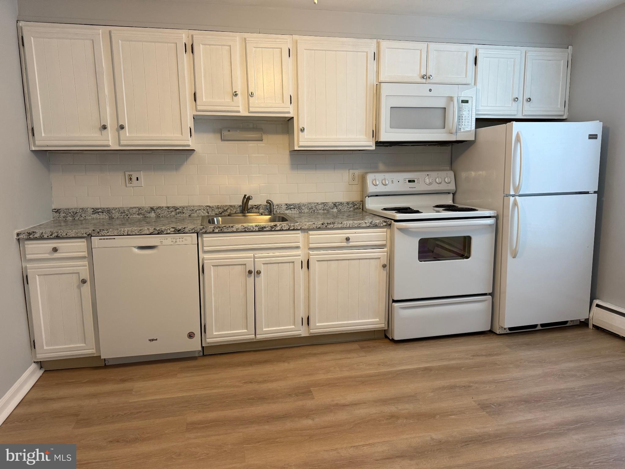 27 Wallingford Avenue, Unit B3 Wallingford, PA 19086 - Photo 3 of 12 Modern kitchen with sleek cabinetry.