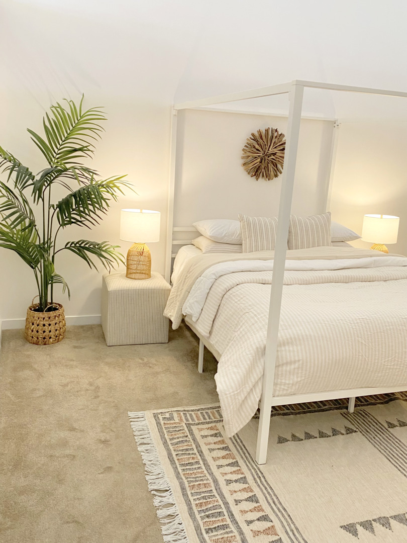 1224 West Van Buren Street, Unit 810 Chicago, IL 60607 - Photo 13 of 28 a bedroom with a bed and a potted plant