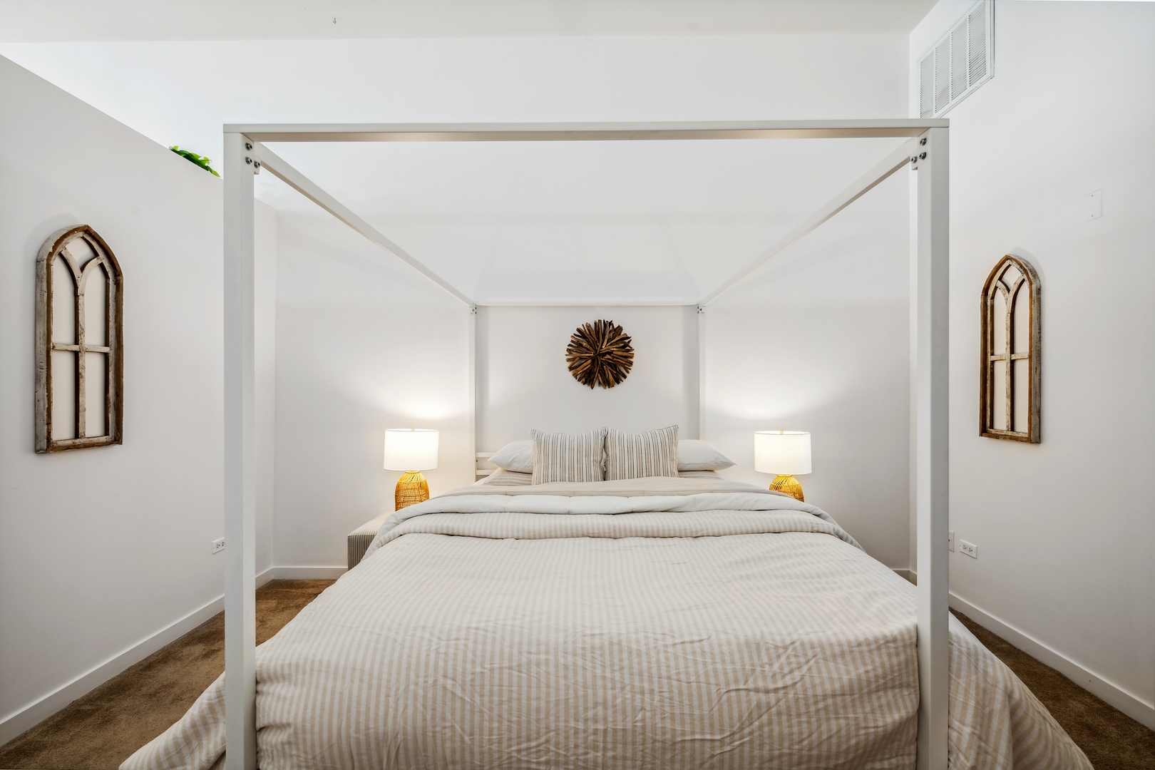 1224 West Van Buren Street, Unit 810 Chicago, IL 60607 - Photo 15 of 28 a bedroom with a bed and a chandelier