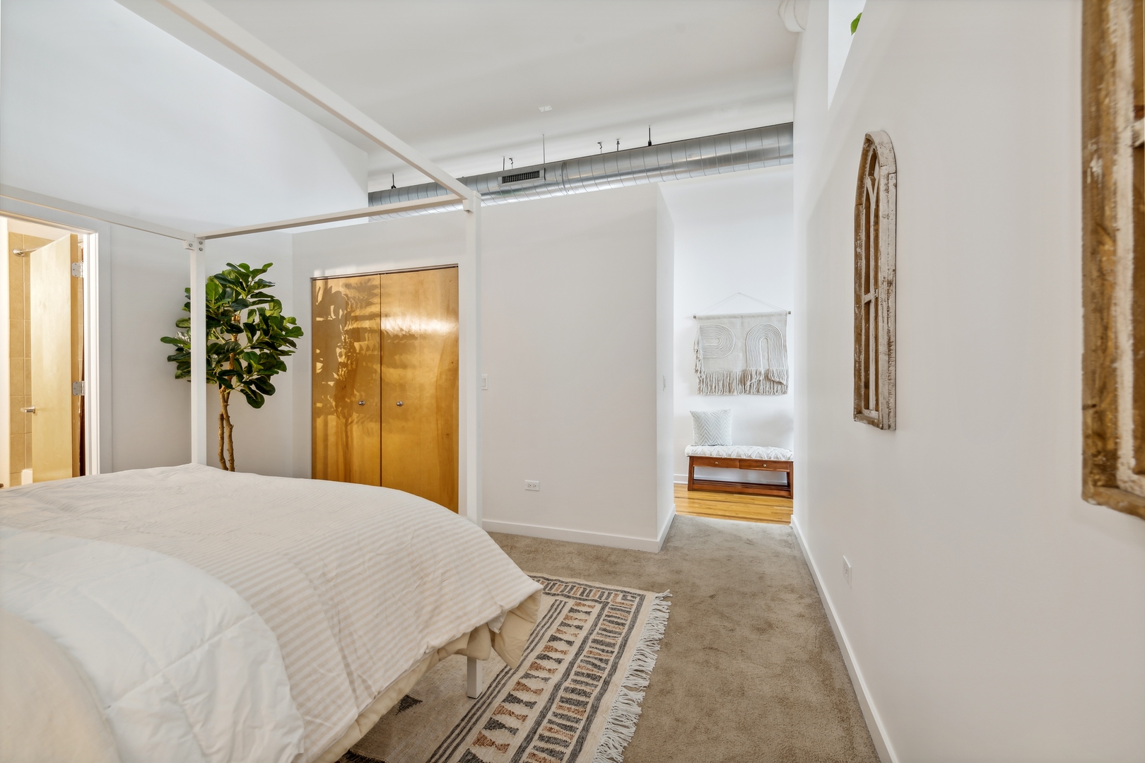 1224 West Van Buren Street, Unit 810 Chicago, IL 60607 - Photo 16 of 28 a bedroom with a bed and a window
