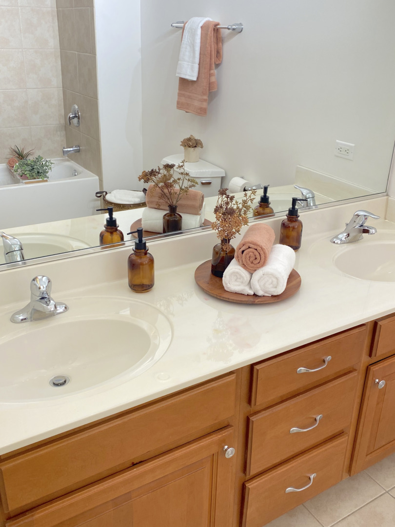 1224 West Van Buren Street, Unit 810 Chicago, IL 60607 - Photo 18 of 28 a bathroom with a sink and a mirror