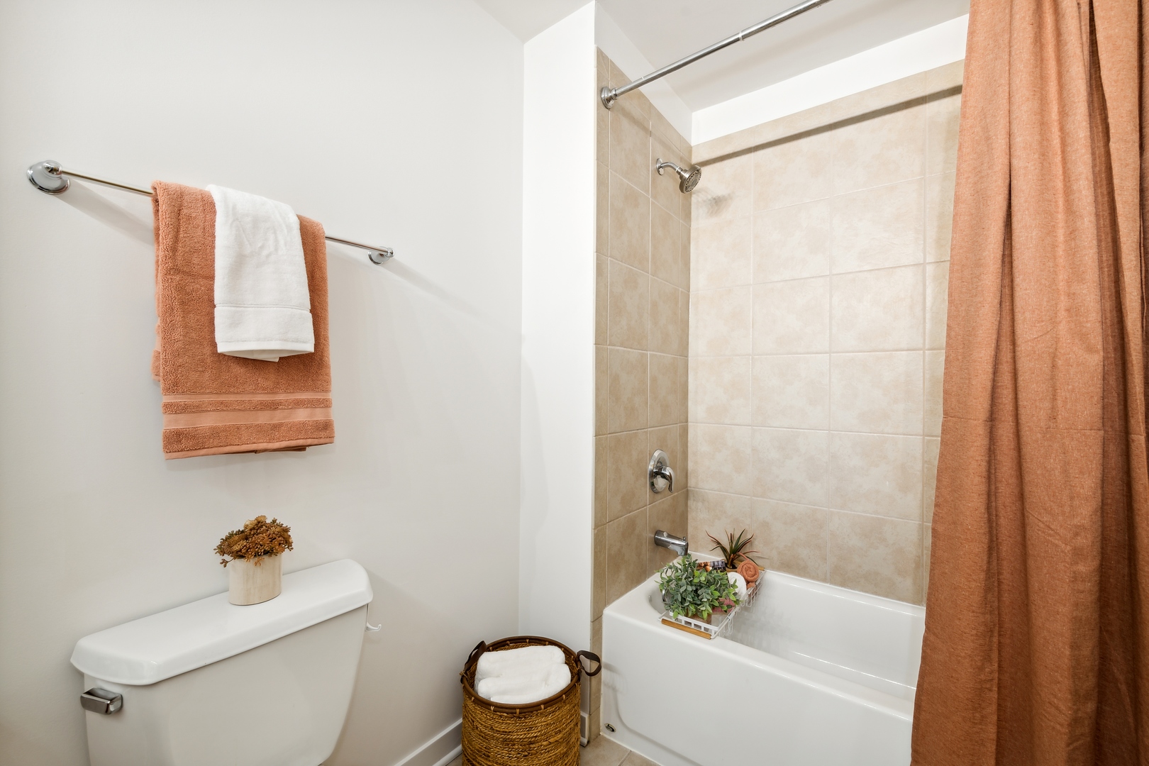 1224 West Van Buren Street, Unit 810 Chicago, IL 60607 - Photo 19 of 28 a white toilet sitting next to a bath tub
