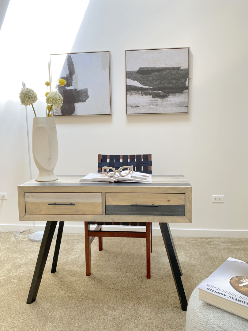 1224 West Van Buren Street, Unit 810 Chicago, IL 60607 - Photo 24 of 28 a room with a table chair and white walls