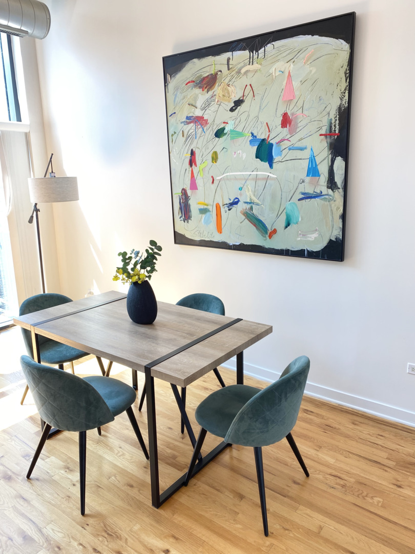 1224 West Van Buren Street, Unit 810 Chicago, IL 60607 - Photo 4 of 28 a view of a room with furniture and wooden floor