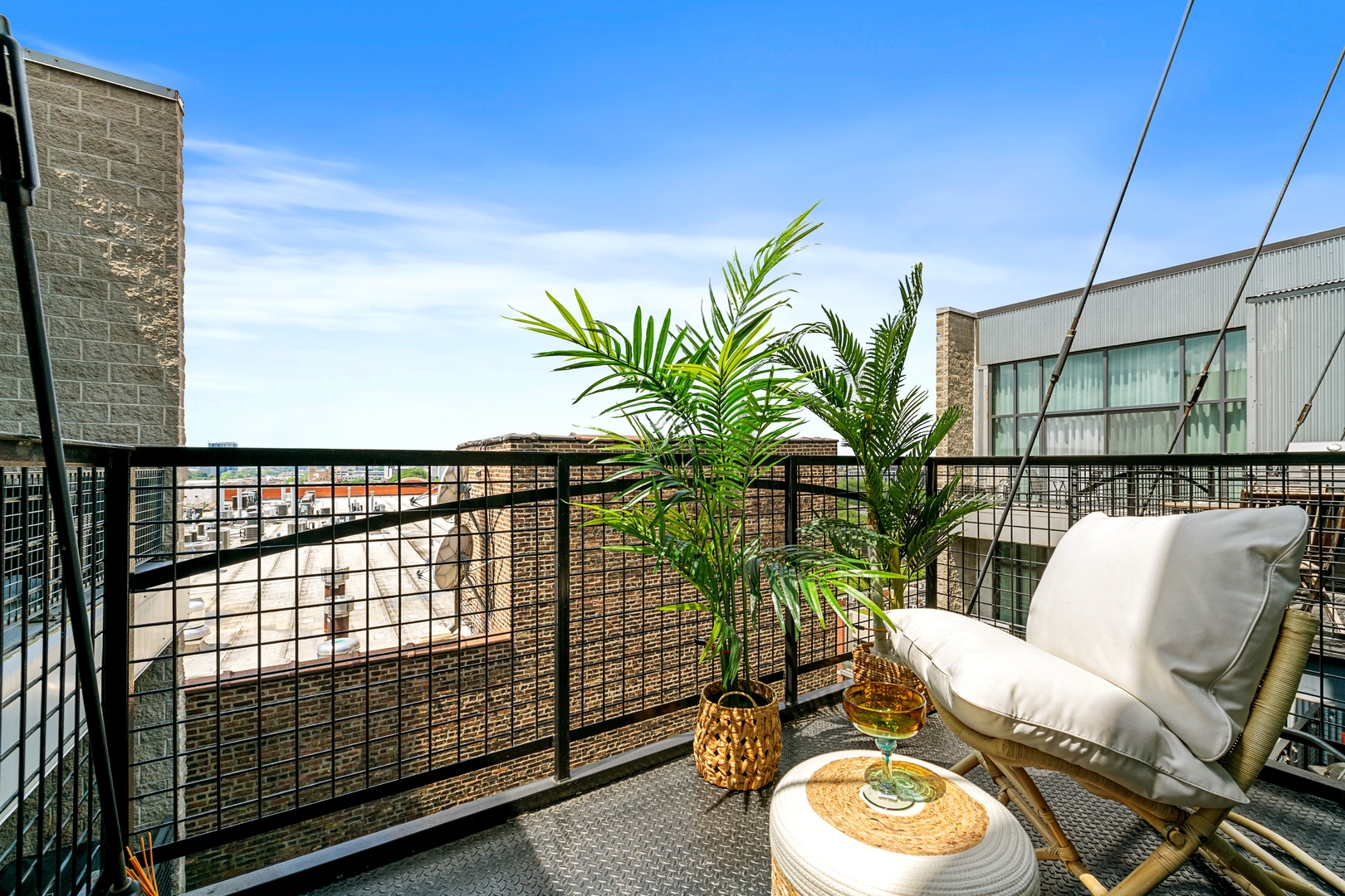 1224 West Van Buren Street, Unit 810 Chicago, IL 60607 - Photo 10 of 28 a view of a balcony with furniture