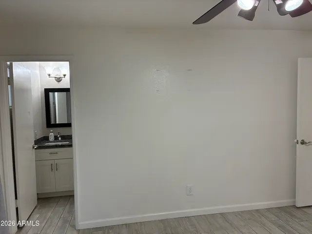 a room with a chair and a wooden floor