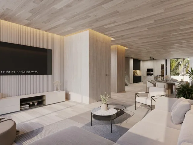 a living room with furniture a large window and a wooden floor