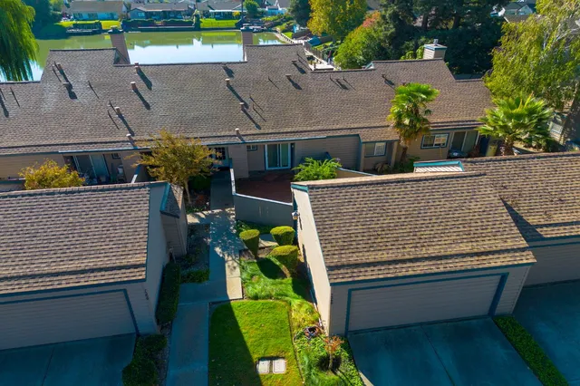 an outdoor sitting area with furniture