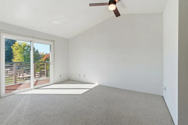 a view of balcony with wooden floor and fence