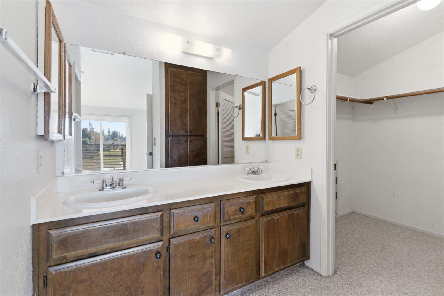 7348 Lighthouse Drive Stockton, CA 95219 - Photo 34 of 56 a bathroom with a sink and a mirror