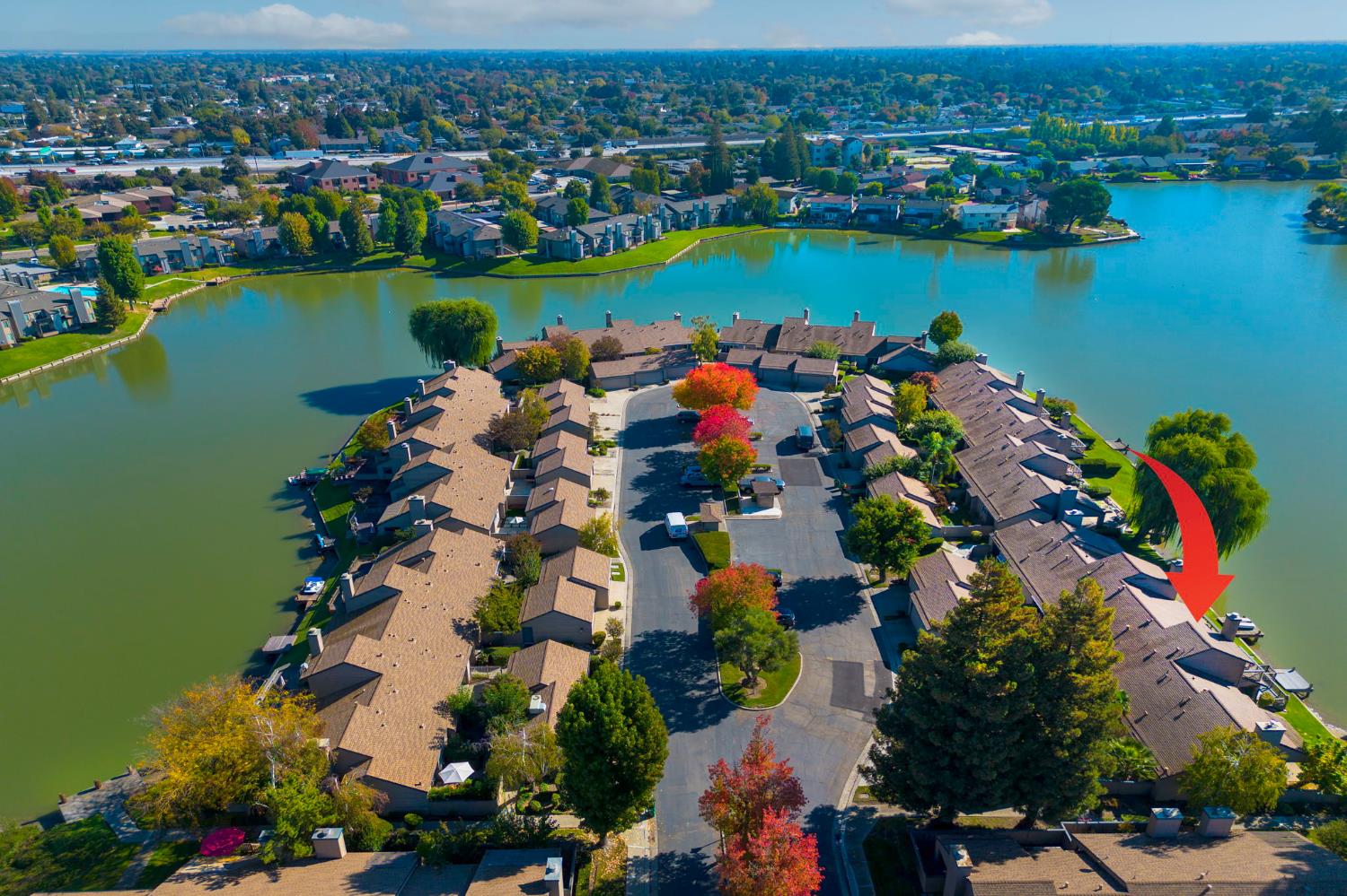 7348 Lighthouse Drive Stockton, CA 95219 - Photo 50 of 56 an aerial view of a city with lake view