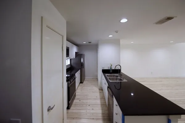 a view of wooden floor and dining room