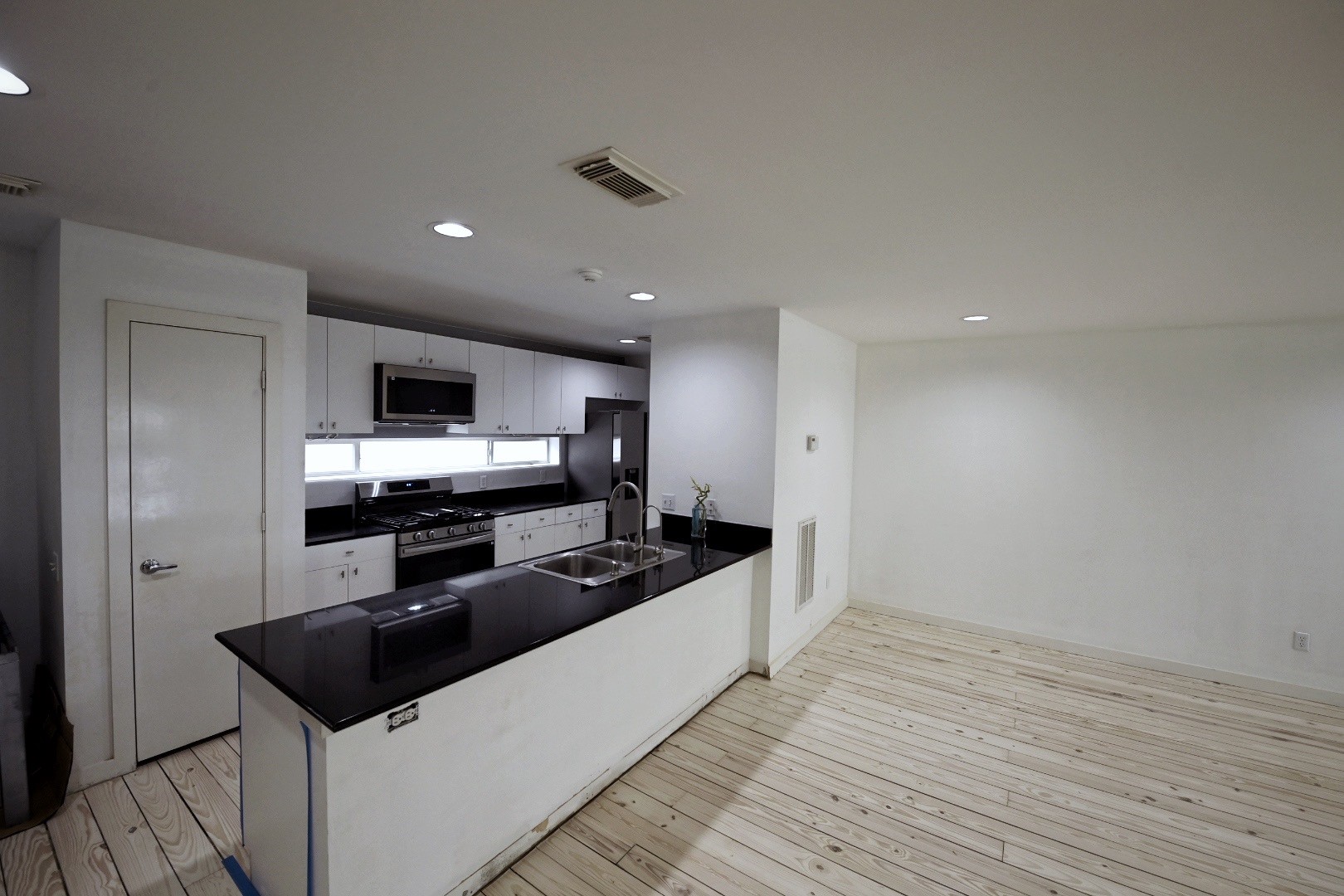 702 Ruthven Street Houston, TX 77019 - Photo 6 of 18 a kitchen with stainless steel appliances a stove a sink and a refrigerator