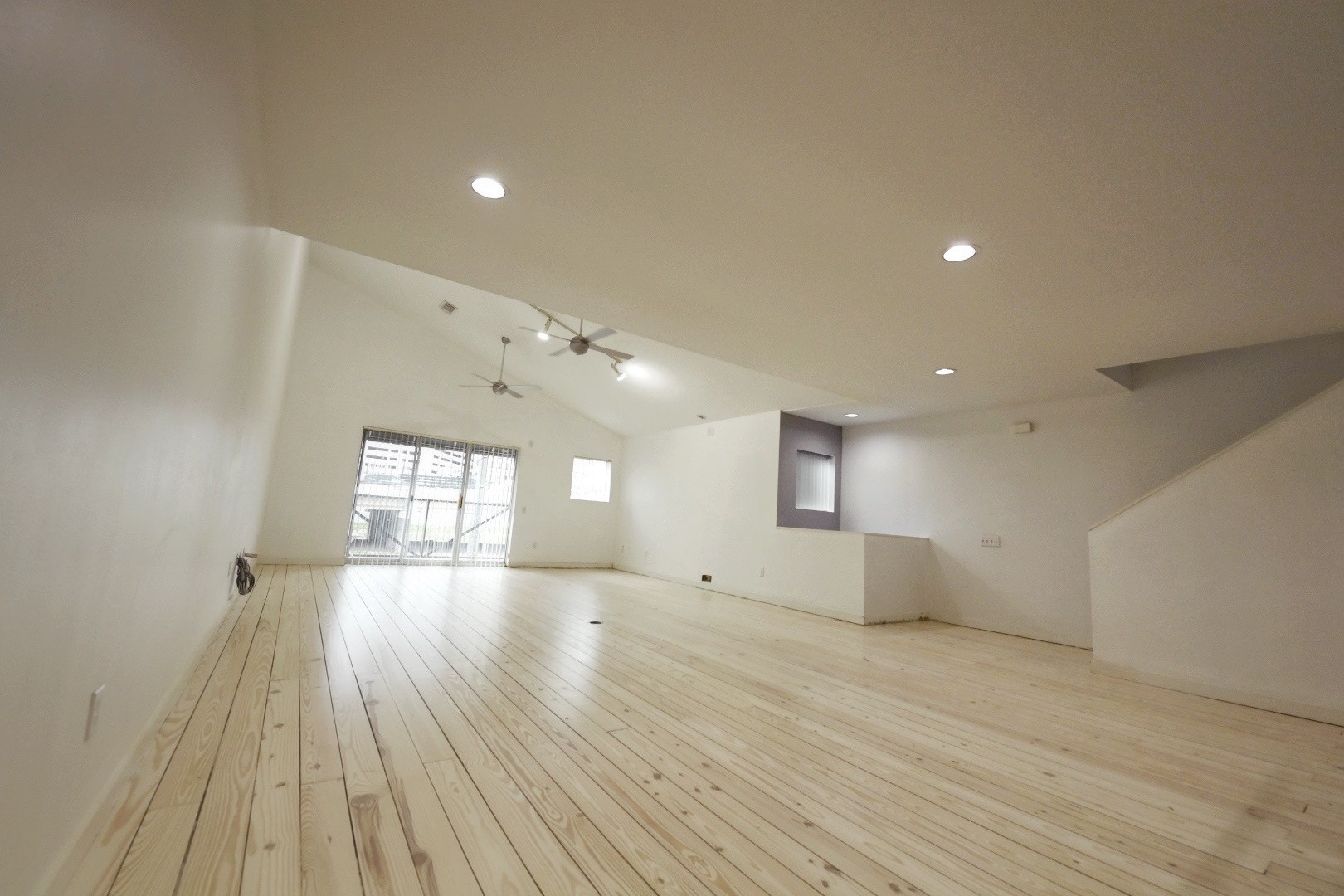 702 Ruthven Street Houston, TX 77019 - Photo 8 of 18 a view of empty room with wooden floor and fan